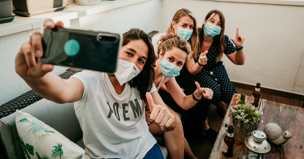 Family members in face masks take a group photo