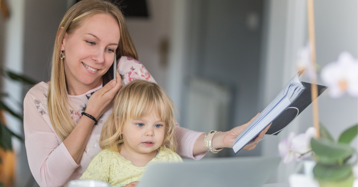 Woman working from home with child