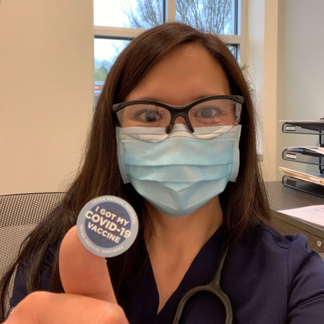 Tryon doctor shares her COVID-19 vaccination sticker