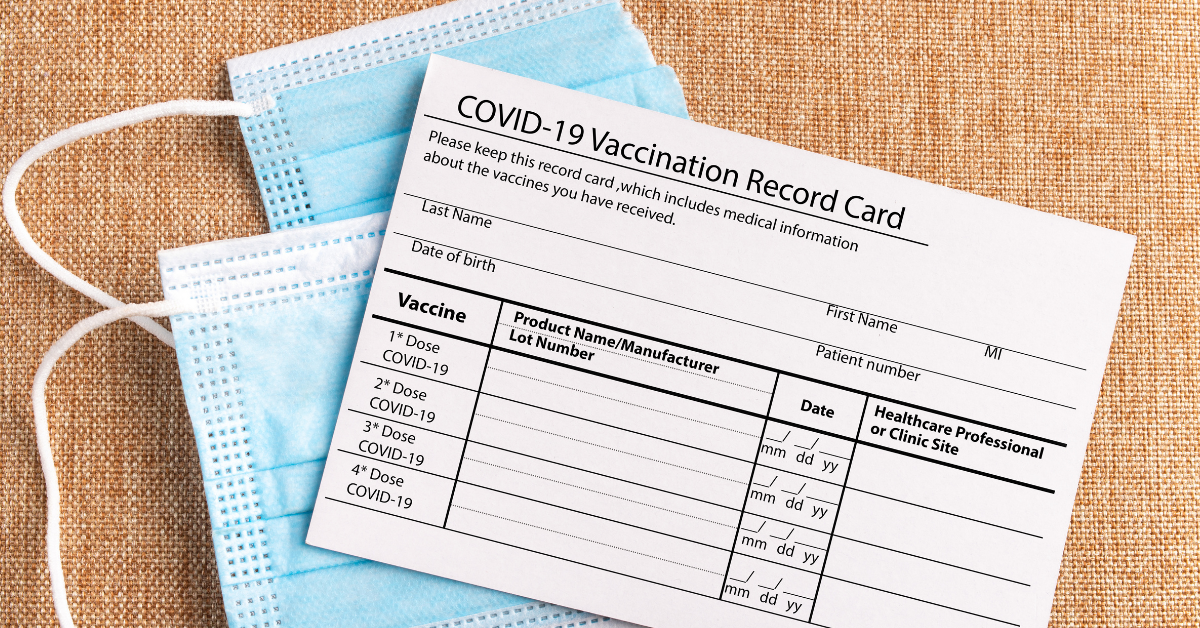 COVID-19 vaccine card and masks