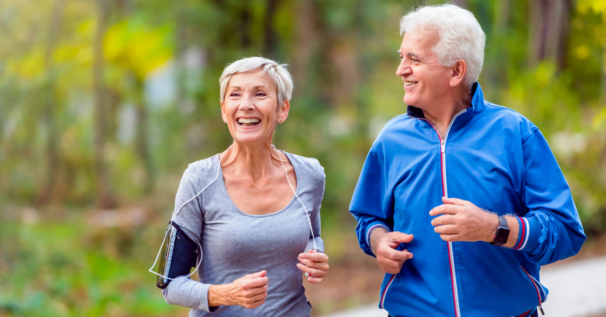 Senior man and woman running